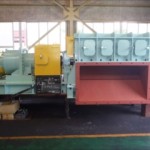 Crusher with foreign material ejection system